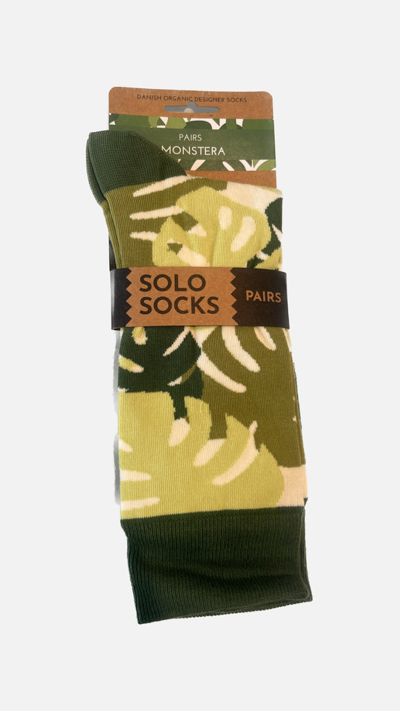 SOLOSOCKS - Monstrea strømper i pakke med label.